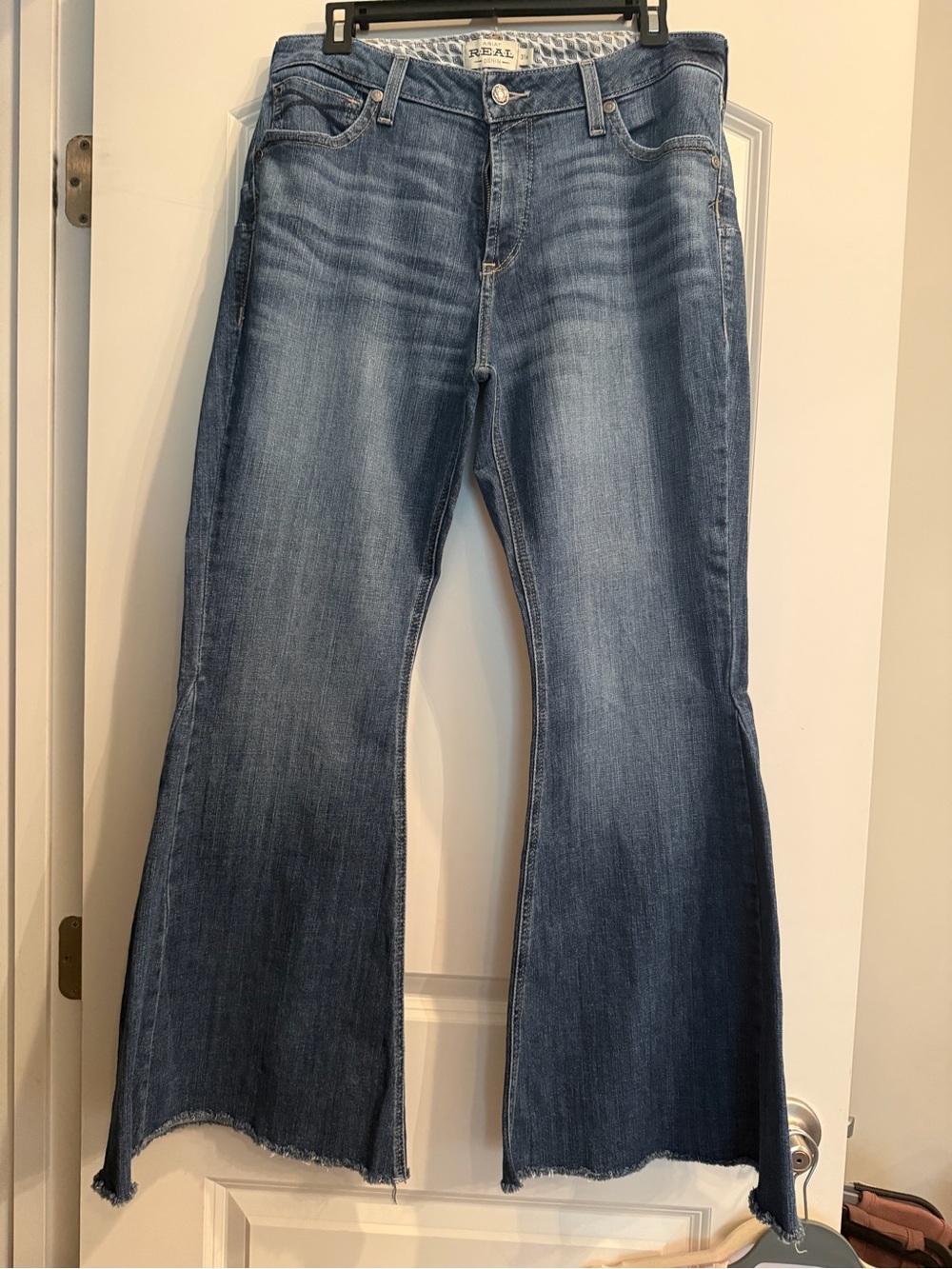 Ariat REAL Denim High Rise Flare Jeans. Size 31 with raw hem. Like New.